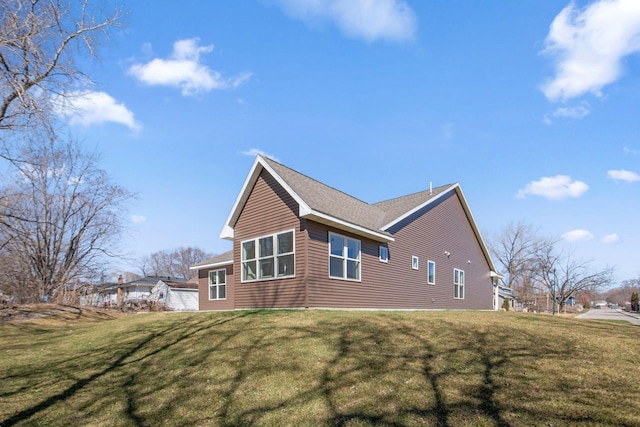 view of property exterior with a yard