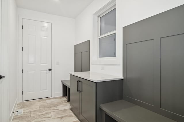 mudroom with visible vents and marble finish floor