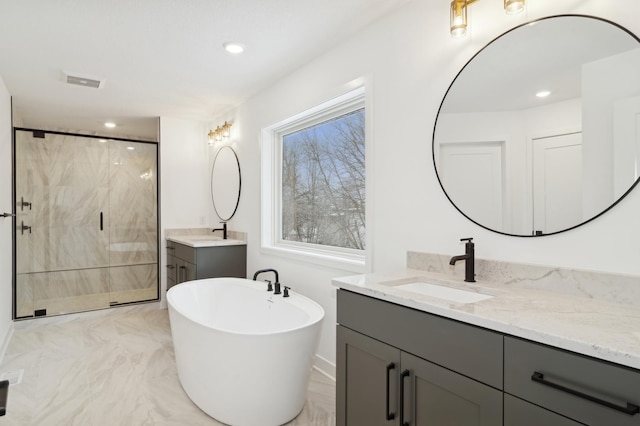 bathroom with a sink, a soaking tub, two vanities, and a shower stall