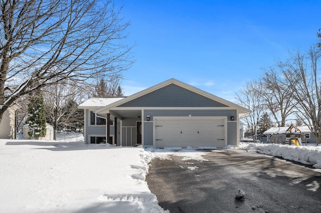 view of front of home with a garage and driveway