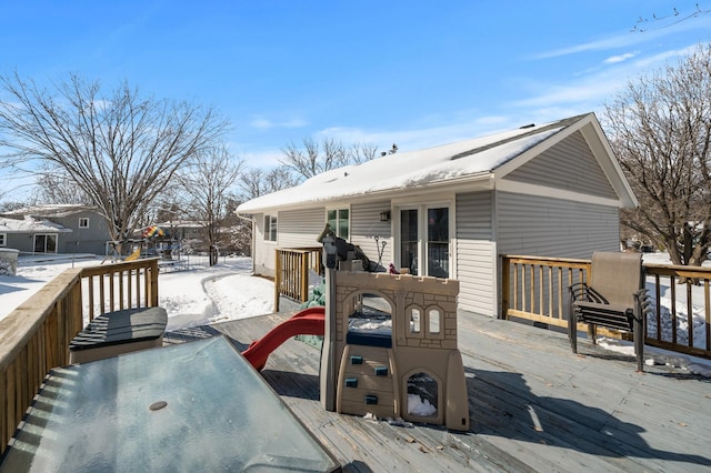 snow covered deck with outdoor dining space