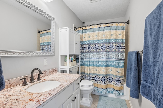 bathroom with tile patterned flooring, toilet, vanity, shower / bath combination with curtain, and a textured ceiling