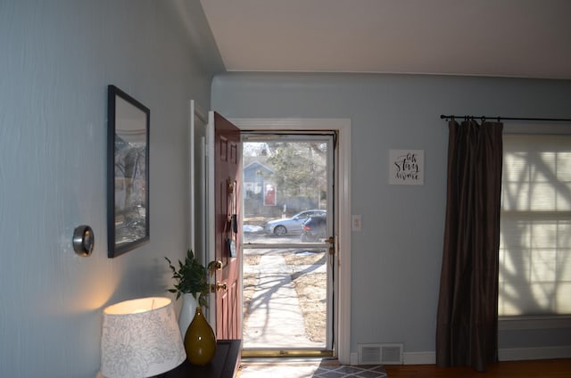 entryway with visible vents and baseboards