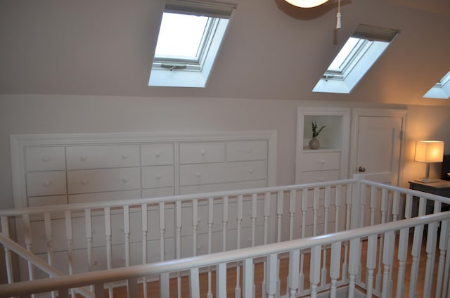 bonus room featuring vaulted ceiling with skylight