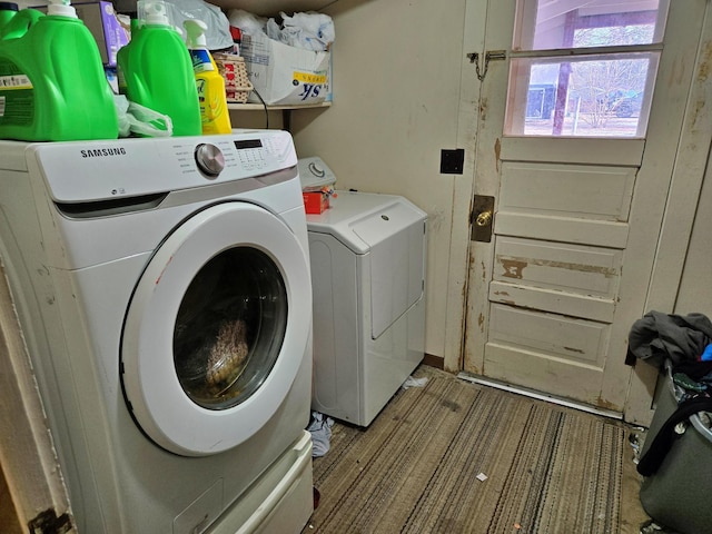 washroom featuring washer and dryer and laundry area