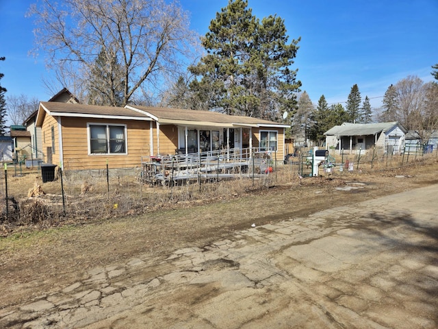 back of house with central AC unit and fence