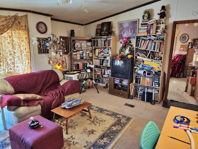 living area featuring a textured ceiling, crown molding, and carpet