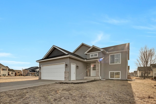 view of front of home with driveway and a garage