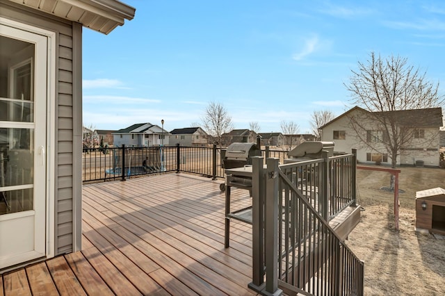 wooden terrace featuring a residential view