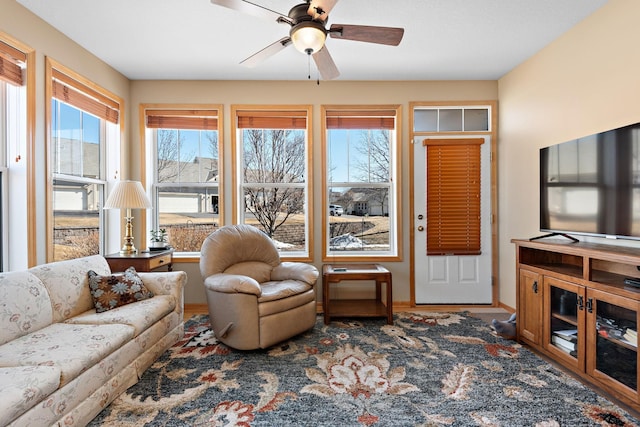 living room featuring a ceiling fan