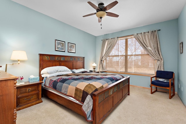 bedroom with baseboards, light colored carpet, and ceiling fan