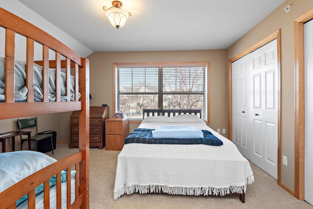 bedroom with carpet flooring and a closet