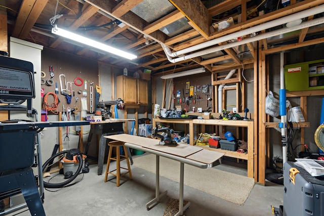 unfinished basement with a workshop area