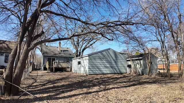 exterior space with fence and a wooden deck