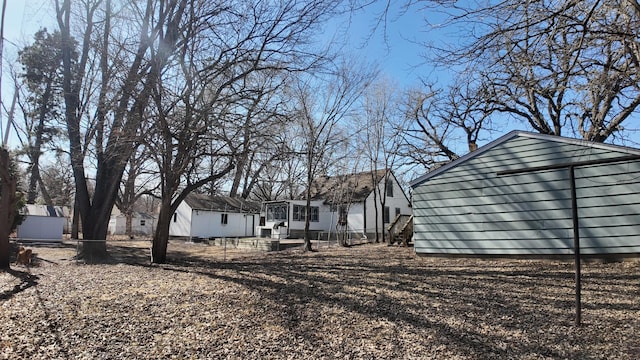 exterior space featuring an outdoor structure and fence