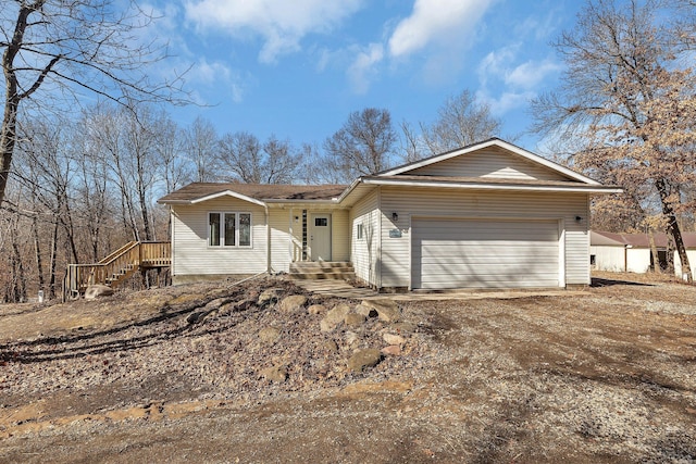 ranch-style house featuring driveway and an attached garage