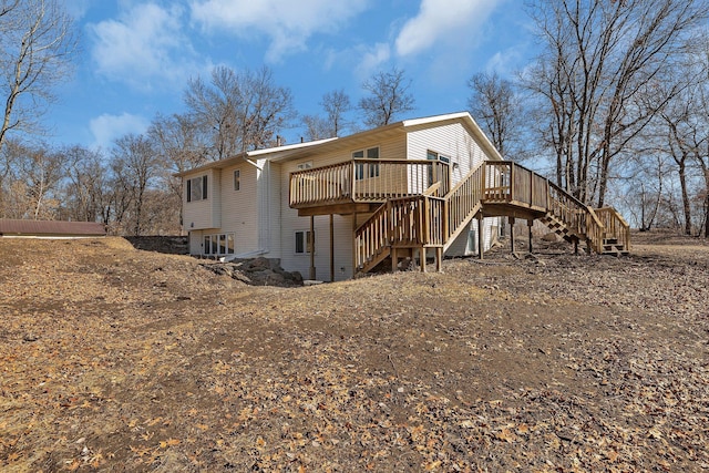 view of side of home with a deck and stairway