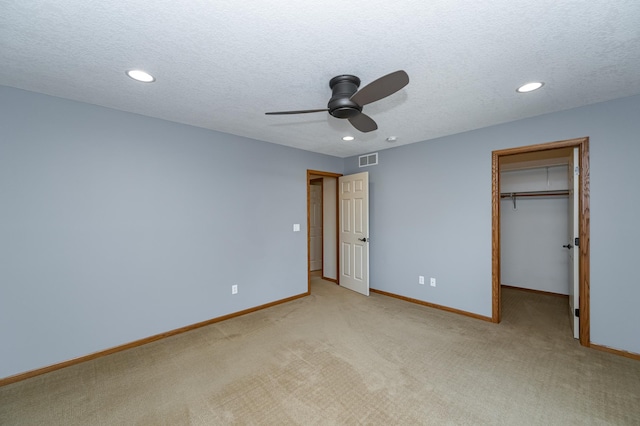 424 11th St NW, Byron, MN 55920 - unfurnished bedroom with light colored carpet, baseboards, visible vents, and recessed lighting