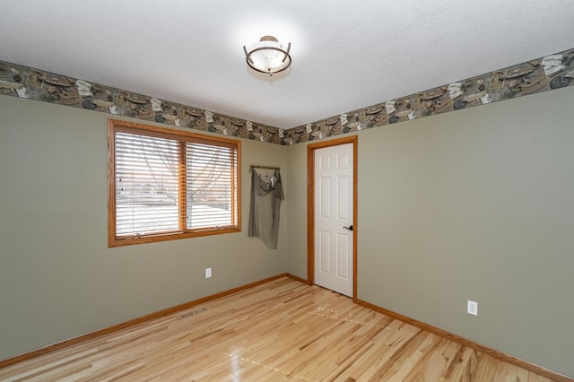 424 11th St NW, Byron, MN 55920 - unfurnished room featuring light wood-style flooring and baseboards