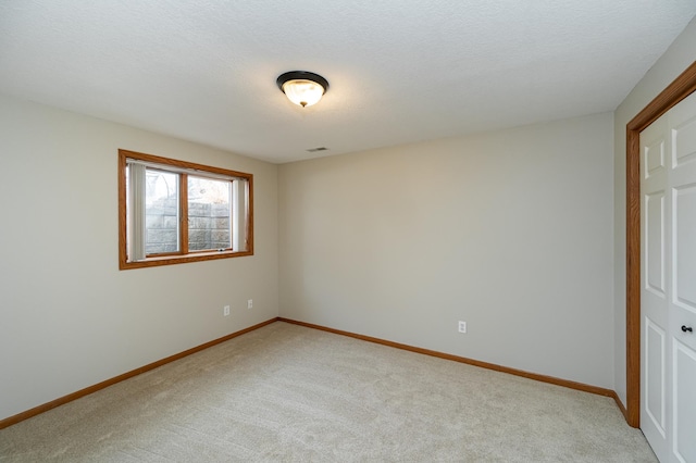 424 11th St NW, Byron, MN 55920 - unfurnished room featuring light colored carpet and baseboards