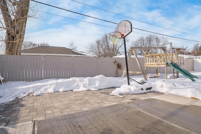 view of patio / terrace featuring a fenced backyard and a playground