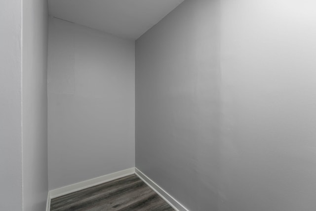 interior space featuring dark wood-style floors and baseboards