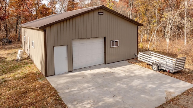 detached garage with concrete driveway