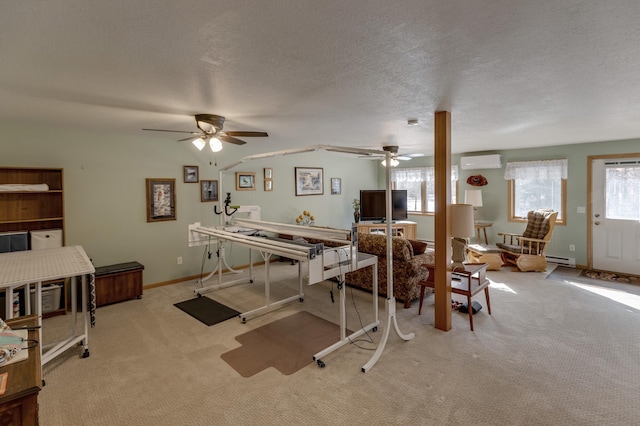 rec room featuring baseboards, carpet flooring, a textured ceiling, a wall mounted AC, and a baseboard radiator