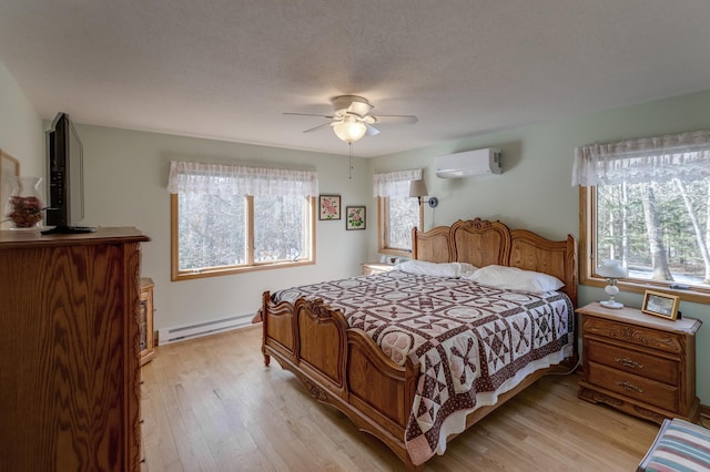 bedroom featuring light wood-type flooring, a baseboard radiator, multiple windows, and a wall mounted AC