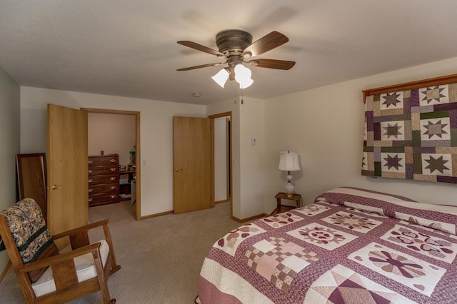 carpeted bedroom with baseboards and a ceiling fan