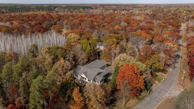 birds eye view of property with a wooded view