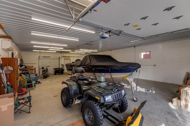 garage featuring an AC wall unit and a garage door opener