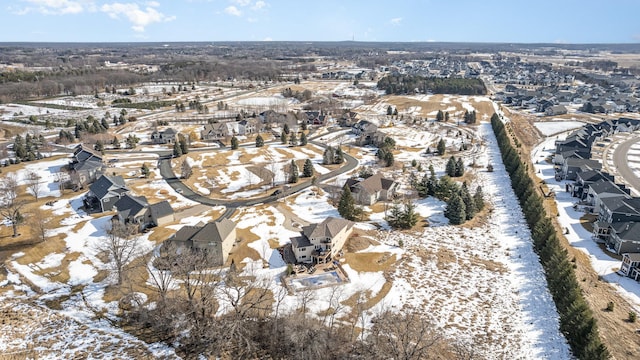 snowy aerial view featuring a residential view