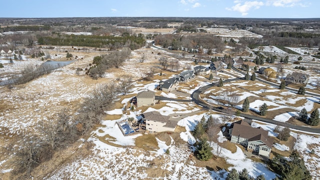 snowy aerial view featuring a residential view