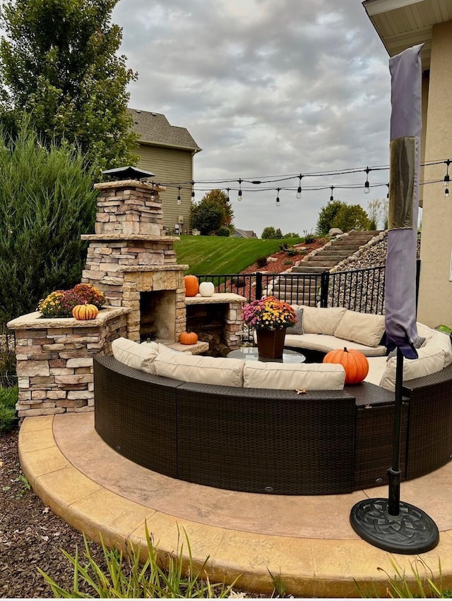 view of patio / terrace featuring an outdoor living space with a fireplace