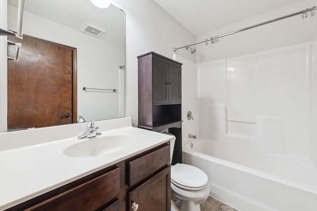 bathroom featuring vanity, toilet, visible vents, and shower / washtub combination