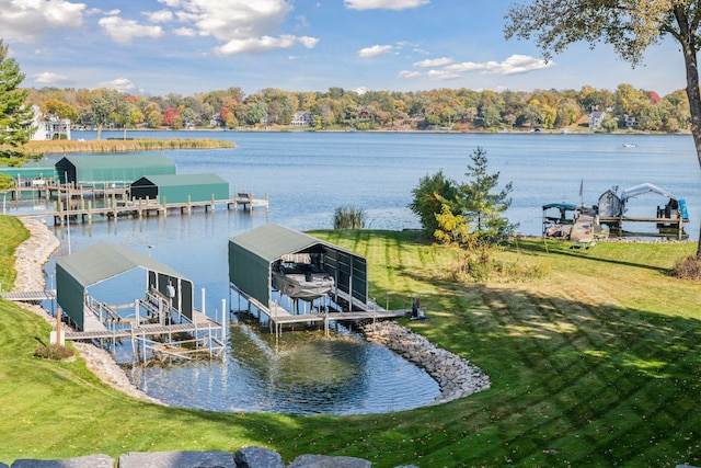 view of dock featuring a lawn, a water view, and boat lift