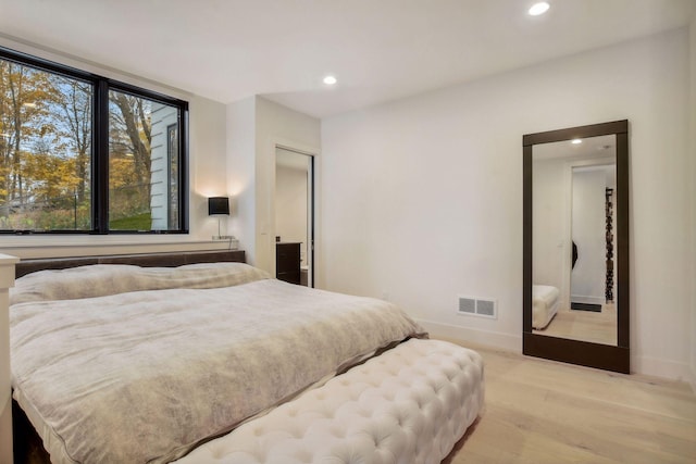 bedroom with recessed lighting, visible vents, baseboards, and light wood-style flooring