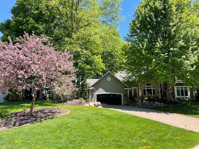 6331 Summit Cir, Chanhassen, MN 55317 - view of front of property featuring a front lawn, an attached garage, and driveway
