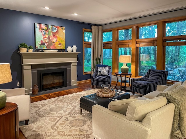 6331 Summit Cir, Chanhassen, MN 55317 - living room featuring wood finished floors, recessed lighting, a fireplace with flush hearth, and baseboards