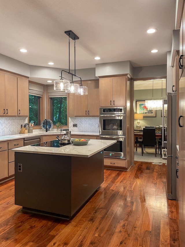 6331 Summit Cir, Chanhassen, MN 55317 - kitchen with stainless steel appliances, a kitchen island, decorative backsplash, recessed lighting, and dark wood-style flooring