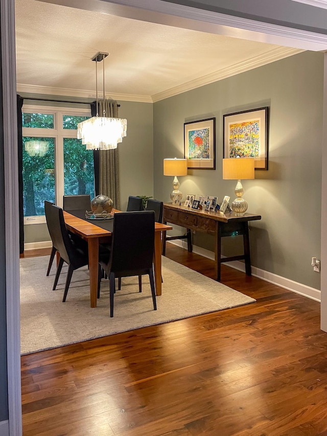 6331 Summit Cir, Chanhassen, MN 55317 - dining room featuring ornamental molding, baseboards, a chandelier, and wood finished floors