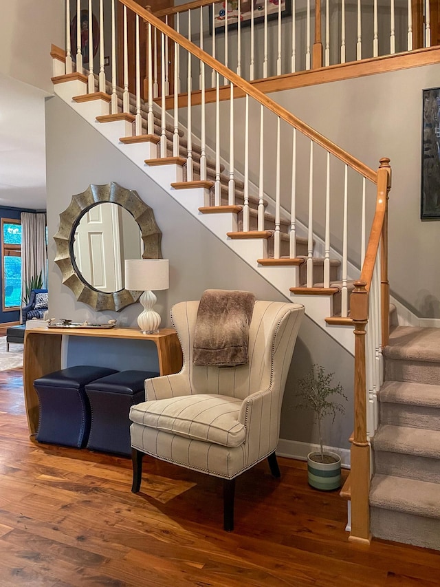 6331 Summit Cir, Chanhassen, MN 55317 - stairs featuring wood-type flooring, baseboards, and a towering ceiling