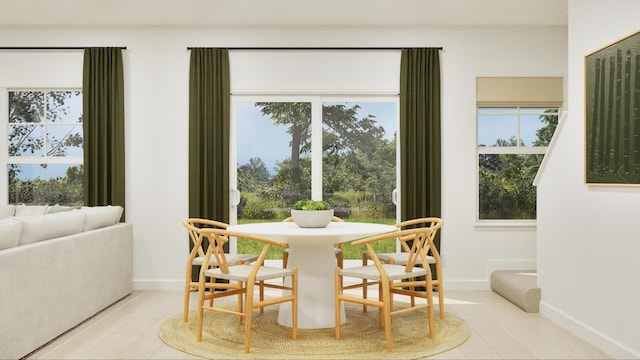 dining room featuring baseboards and wood finished floors