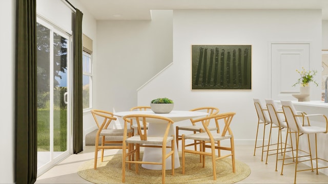 dining room featuring baseboards and wood finished floors