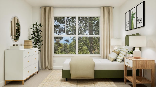 bedroom featuring light carpet