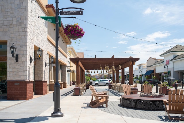 view of property's community featuring a residential view and a fire pit