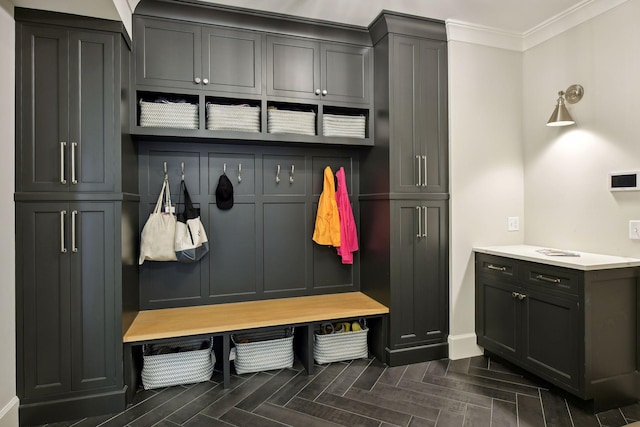 mudroom featuring crown molding