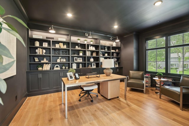 office area featuring built in shelves, recessed lighting, light wood finished floors, and ornamental molding