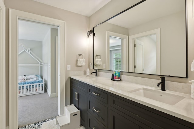 full bathroom featuring a sink and double vanity